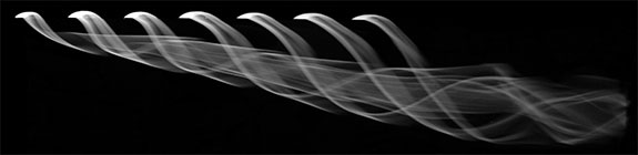 Streamwise Vortices Generated by Rolling Up Shear Layers