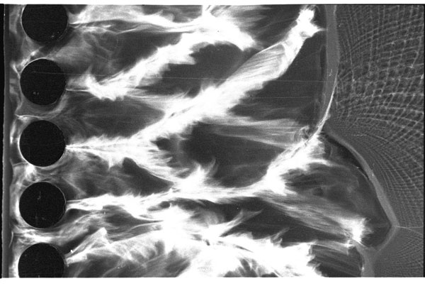 Detonation Waves in a Thin Channel Downstream of Cylinder Rows