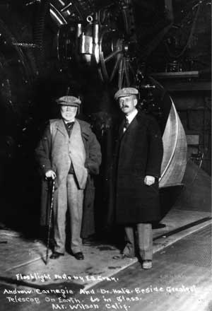 Andrew Carnegie and George Hale standing in front of 60 inch telescope, Mt.Wilson, ca. 1908.